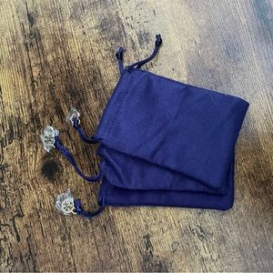 Three small Tory Burch jewelry pouches